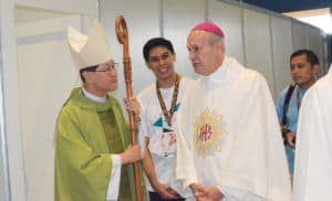 From left: Cardinal Tagle, Gio Francsico, (a Focolare youth and author of this article), and Archbishop Gabriele Giordano Caccia, Apostolic Nuncio to the Philippines, at the Genfest in Manila